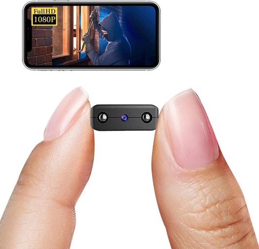 Small camera device held between two fingers with a smartphone screen displaying video footage.